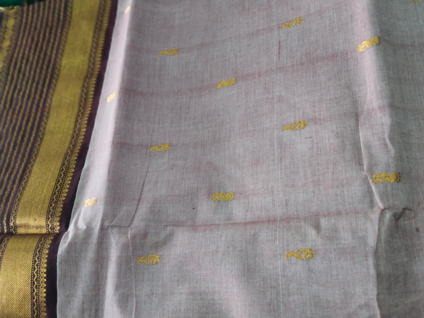 Rich cotton pastel brown saree with Neli Border & grand mango pallu