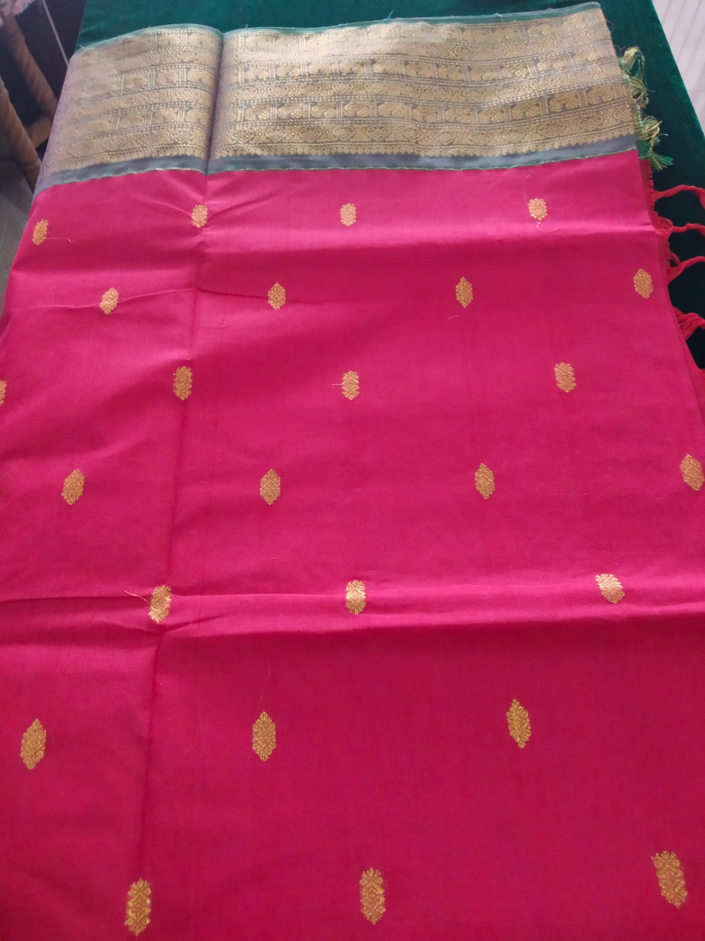 Rich Cotton Rani pink saree with pastel rama green peacock border