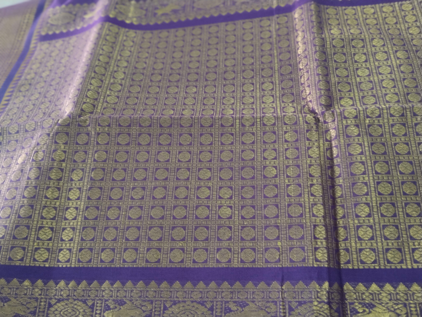 Deep violet vintage design buttas and very grand pallu saree