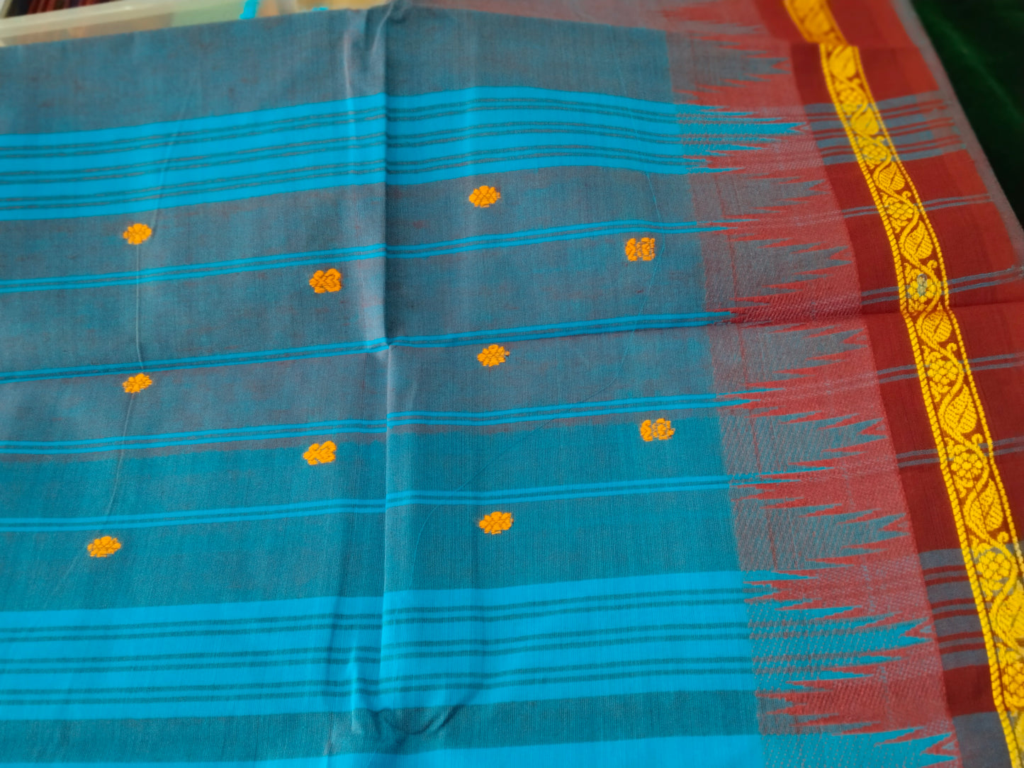 Blue pure cotton saree with traditional thread buttas all over with double side tower border