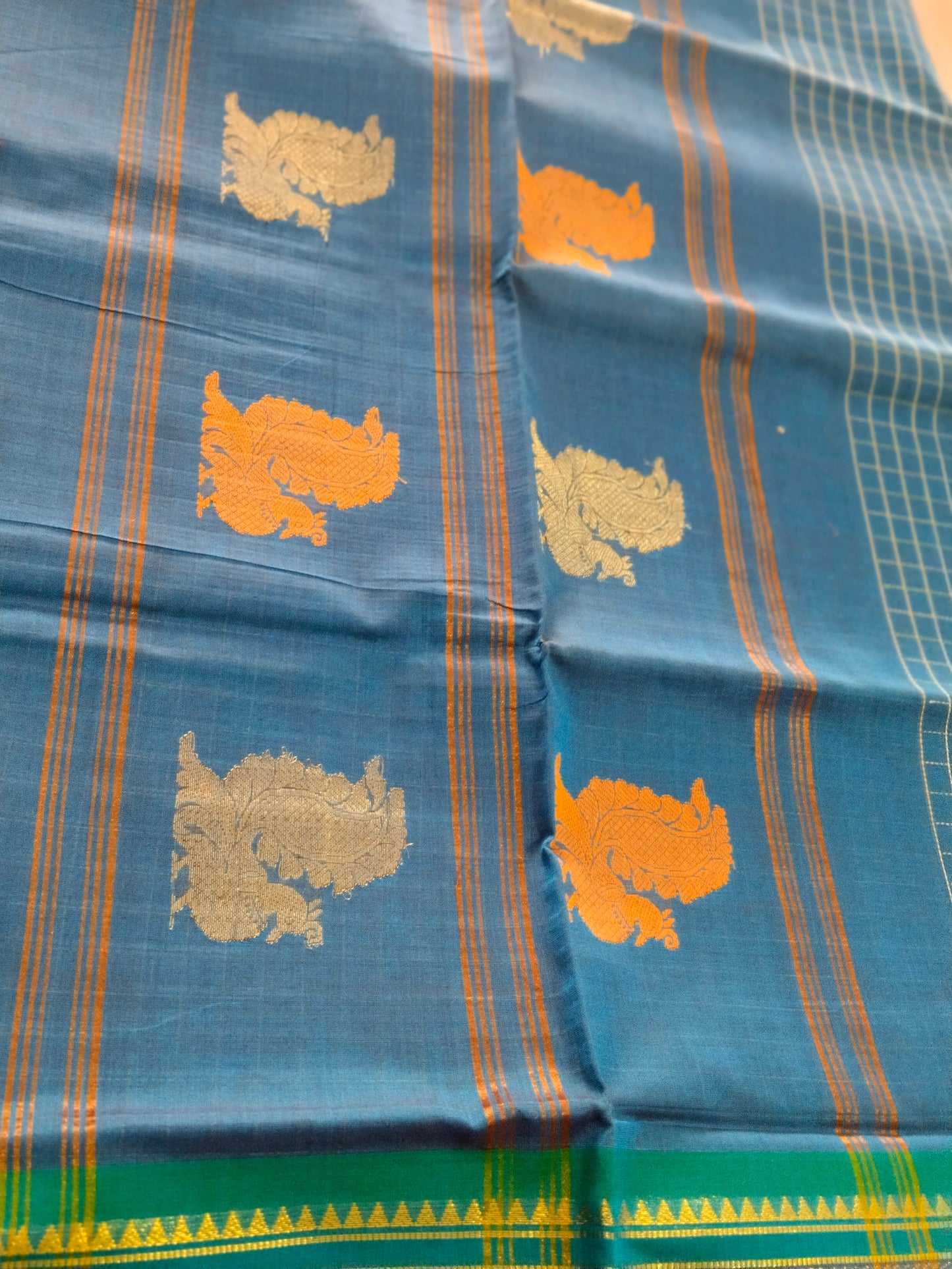 Teal blue pure cotton mercerized cotton saree with handmade peacocok buttas in the pallue