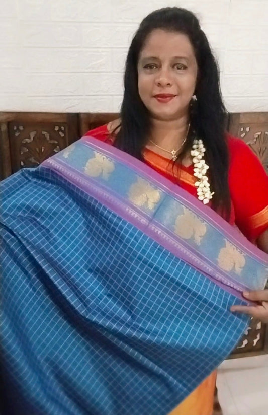 Teal blue pure cotton mercerized cotton saree with handmade peacocok buttas in the pallue